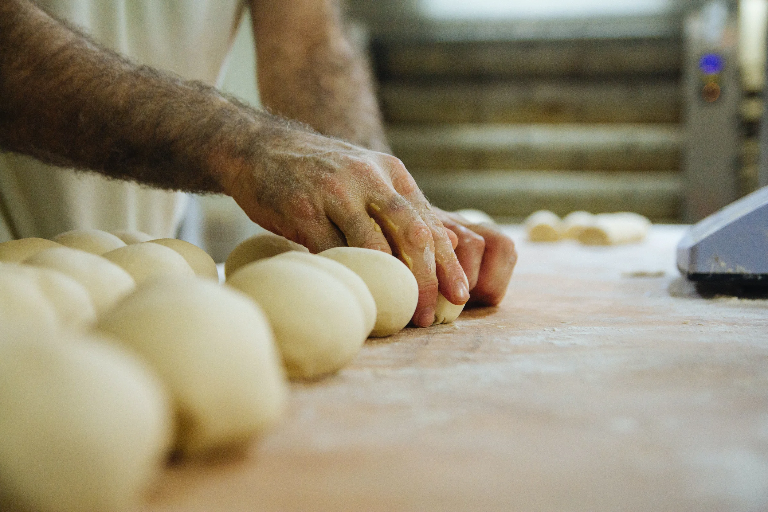 Baker working with dough